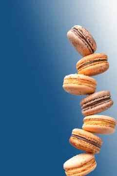 Macaroons group isolated on a blue background. Stock Photos