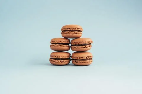 Macaroons isolated on blue background Stock Photos