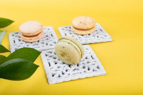 Macaroons isolated on yellow background Stock Photos