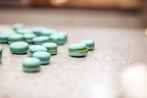 Macaroons lie on the table in the kitchen Stock Photos