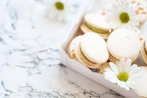Macaroons, macaron cake with chamomile in white box Stock Photos