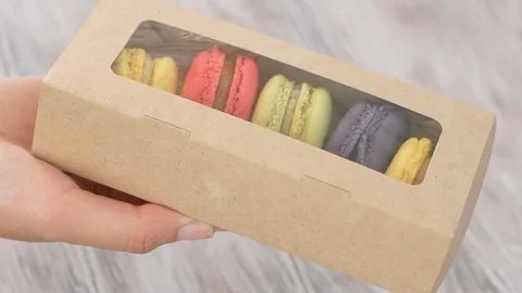 Macaroons presented inside the box Video stock 114025932