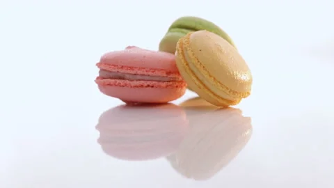 Macaroons rotate on white background. Three cookies macaroons are stacked on top Stock-Footage 194835016