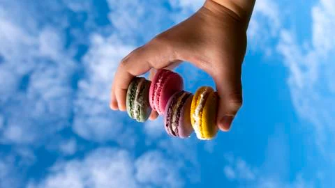 Macaroons on sky background Stock Photos