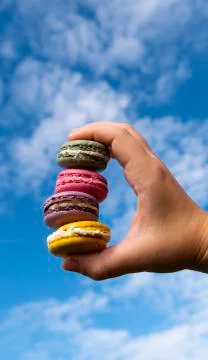 Macaroons on sky backround Stock Photos
