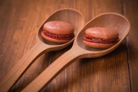 Macaroons in spoon Stock Photos