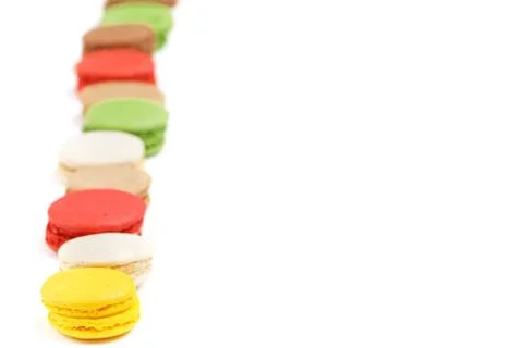Macaroons on a white background. Copy space to the right. Sweet background. Stock Photos