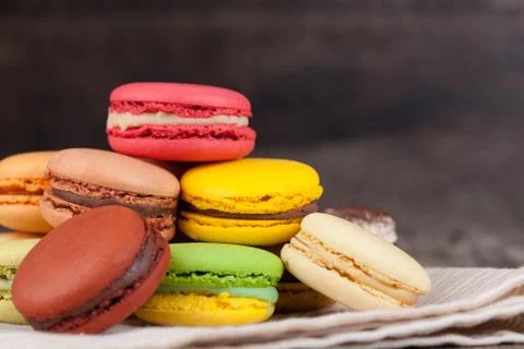 Macaroons on a wooden table Stock Photos