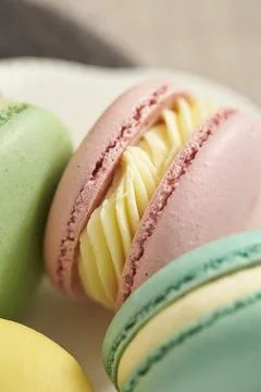 Macaroons on a wooden table Stock Photos