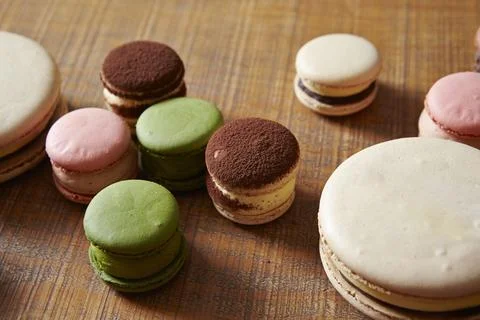 Macaroons on a wooden table Stock Photos