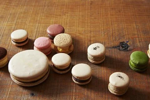 Macaroons on a wooden table Stock Photos