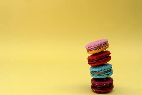 Macaroons on the yellow background Stock Photos