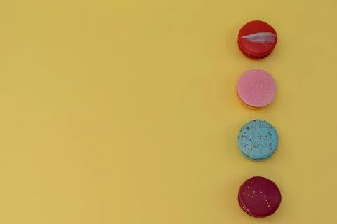 Macaroons on the yellow background Stock Photos