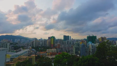 Macau City Skyline with Mountain Backdrop Under Dramatic Clouds Stock Footage 344605493