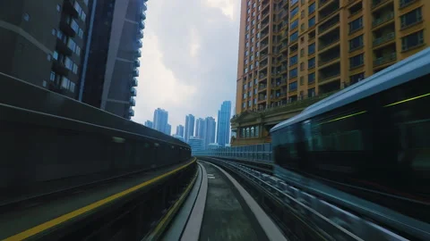 Macau LRT Ride Through Macau's Modern High Rise Skyline Stock Footage 344595677