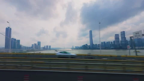 Macau Skyline and Bridge Viewed from a Moving Car Stock Footage 344607322