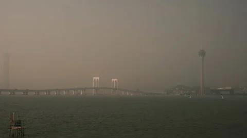 Macau Tower and Sai Van Bridge at sunset - Praia Grande Bay of Nam Van Lake Stockbeeldmateriaal 145549259