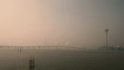 Macau Tower and Sai Van Bridge at sunset - Praia Grande Bay of Nam Van Lake Vidéo 145603708