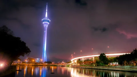 Macau Tower Timelapse at Night with City Reflections in Macau Stock Footage 343155612