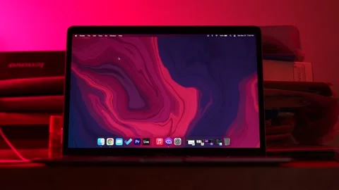 A MacBook air laptop's with vibrant display zoomed out moving shot Vídeo Stock 152162549