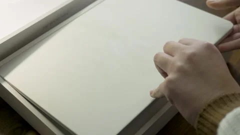 MacBook Air unboxing showcasing lightweight design with ARM M3 chip Stock Footage 313734945