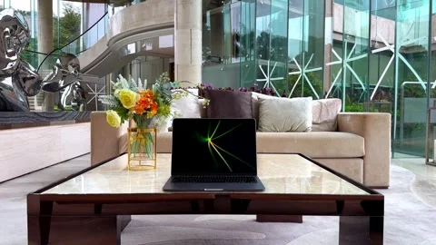 MacBook Laptop Displaying Flurry Screensaver in a Luxurious Upscale Home Stock Footage 254178902