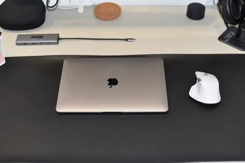 MacBook laptop white Logitech MX Master 4 mouse Stock Photos