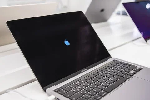 Macbook laptops on the stand in apple store Stock Photos