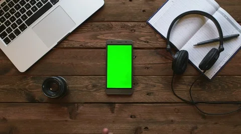 Macbook pro on dark oak desk with android smartphone Stock Footage 63539344