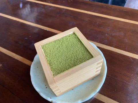 Maccha tiramisu inside the box Stock Photos