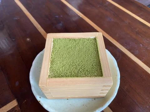 Maccha tiramisu inside the box Stock Photos