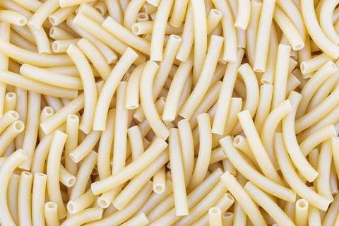 Maccheroni pasta texture on background. Stock Photos