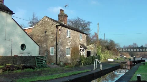 Macclesfield canal Lock keepers cottage on canal rural setting Stock Footage 46843491