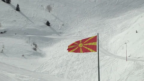 Macedonian flag waving on the cold winter wind in Popova Shapka ski resort in Stock Footage 155717586