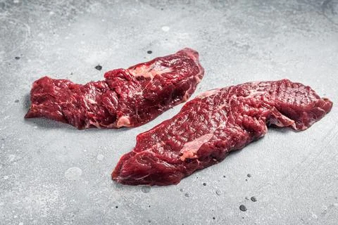 Machete steak raw cut or hanging tender cut. Gray background. Top view Stock Photos