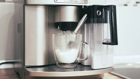 The machine is actively sprinkling the whipped cream Stock Footage 144656885