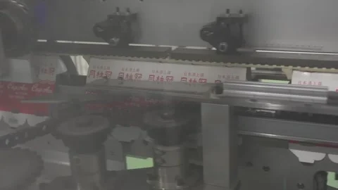 Machine Applying Labels to Sake Bottles on the Line 動画素材 340010829