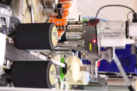 Machine for applying self-adhesive labels. The machine is designed for automa Stock Photos