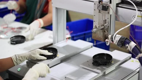 The machine of automatic glue applying machine in autoparts factory. Stock Footage 299525199