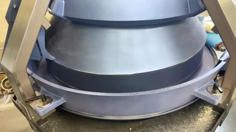 Machine at the bakery, kneading the dough and eject it on the production line Stock Footage 252116493