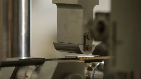 Machine bending steel bar in the laboratory close up Stock Footage 72712662