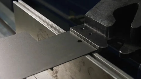 Machine bends metal sheet to make detail in workshop closeup Stock-Footage 122218268