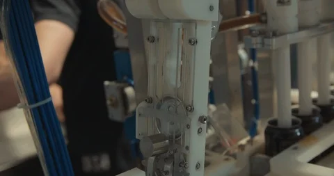 Machine At Brewery Filling And Capping Cans In Slow Motion 動画素材 105335686