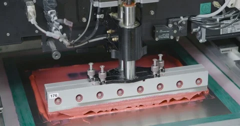 Machine causes the pink sealant on PCB. Closeup Video stock 73502076