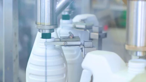 The machine is checking the packaging and bottles within the industrial plant. Stock Footage 128344903