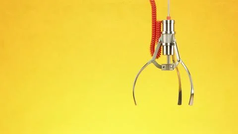 Machine  claw on yellow background. Crane game. 3d illustration Stock Illustration