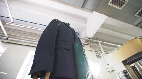 Machine cleaning jacket in a dry-cleaning Stock Footage 64757408