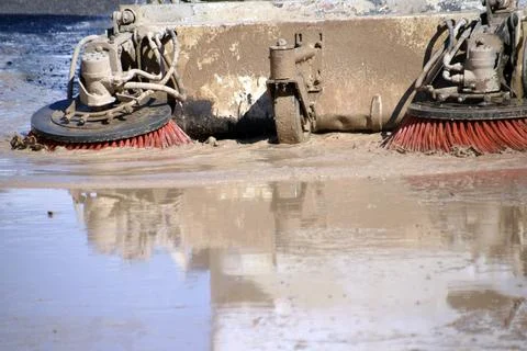 A machine cleans mud from flooding in Los Alczares, Murcia. Stock Photos