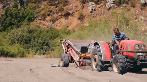 The machine cleans sifts the sand on the beach Stock Footage 44372606