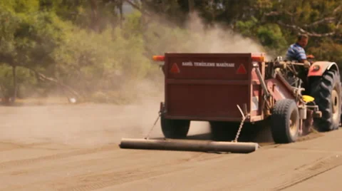 The machine cleans sifts the sand on the beach Stock Footage 44372723